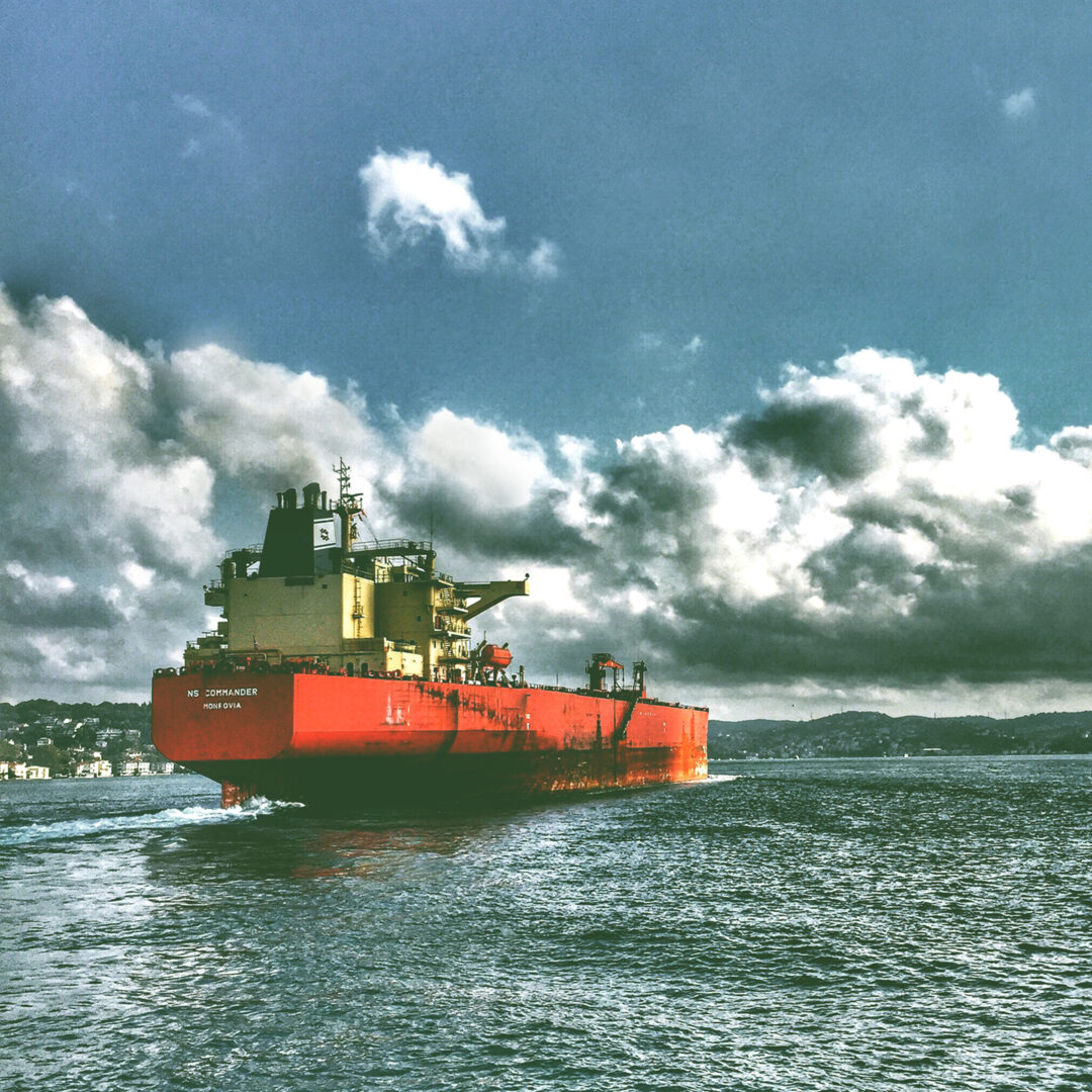 A ship sailing out of port